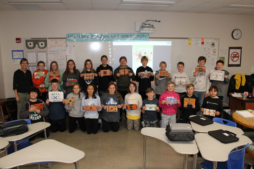 As part of their chapter learning about the Dakota people, 6th grade students designed parfleches, traditional Dakota rawhide carrying cases. Students used traditional colors and designs, on construction paper.