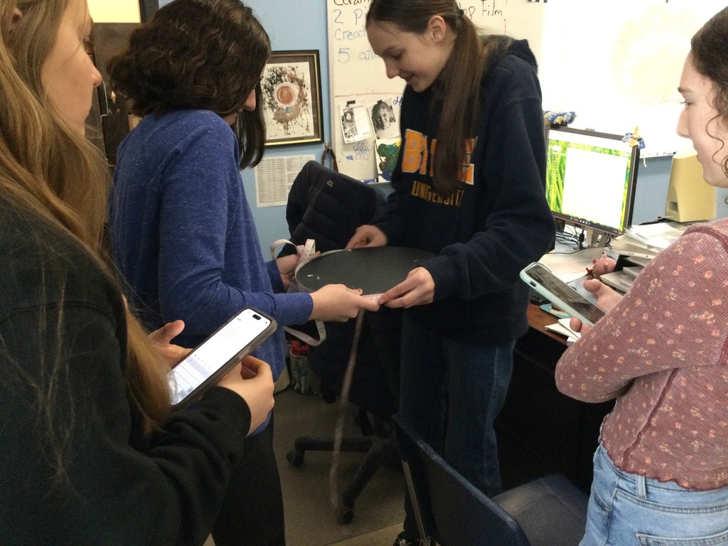 Happy Pi Day - a national celebration of math!  Today, students in Algebra II are measuring as many unique circles as they can find around the building to calculate where the number pi comes from.  (In case you didn't know, pi equals the circumference of a circle divided by its diameter!)