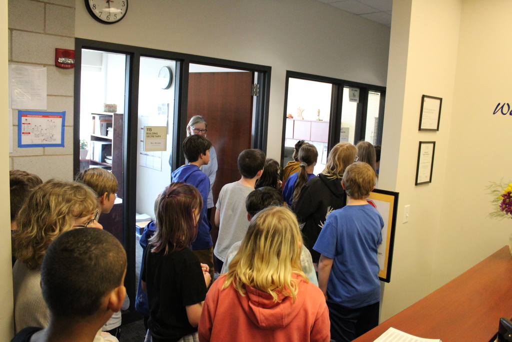 Incoming 6th graders being  shown around the Secondary Office.