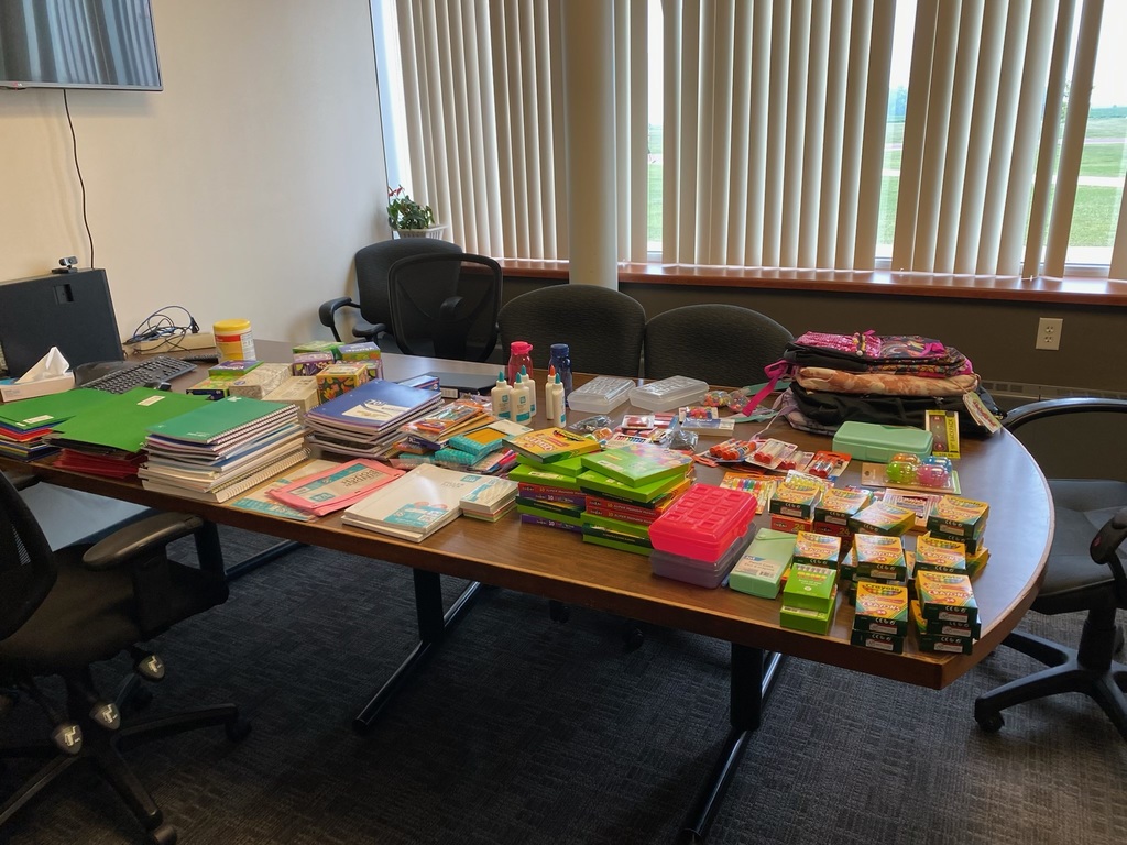 Table full of donated school supplies